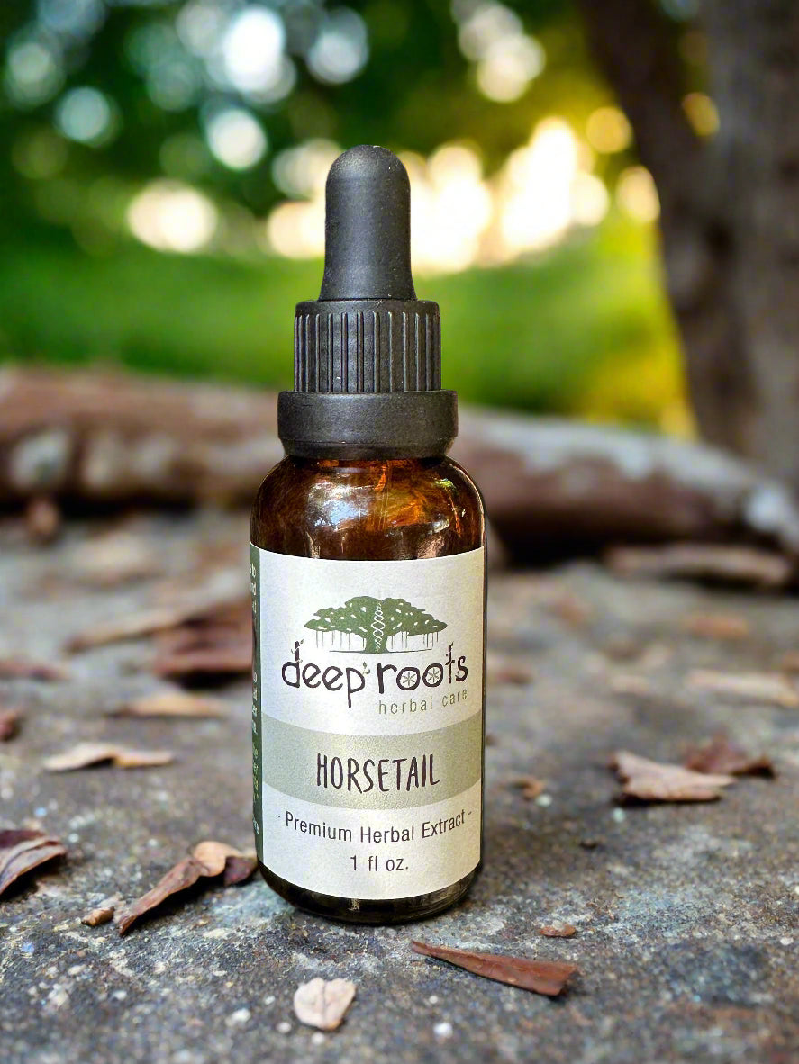 Bottle of deep roots horsetail extract on a wooden background